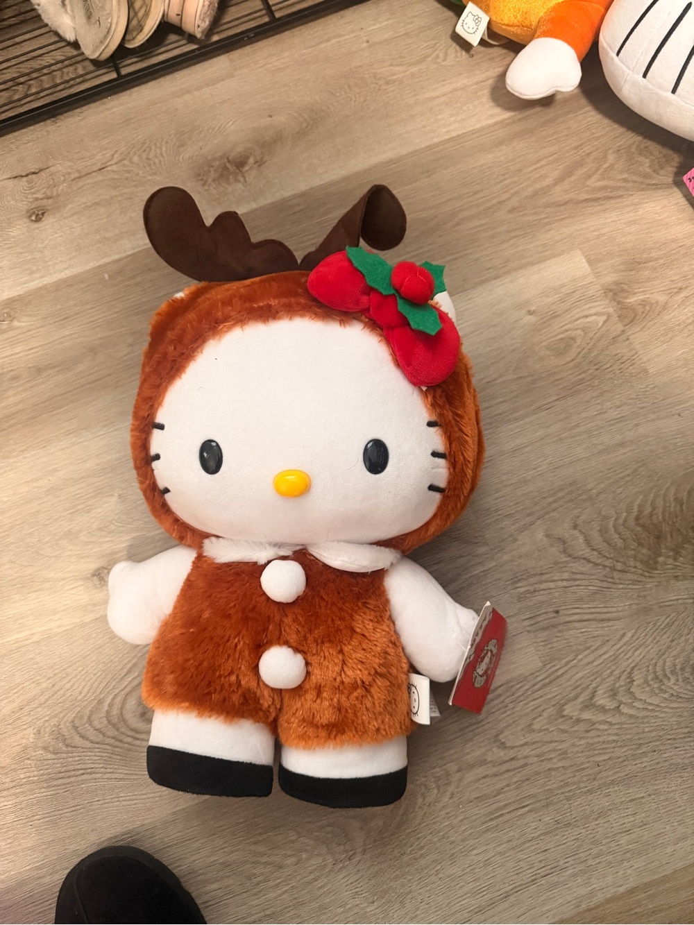 Hello Kitty Brown Reindeer Plush with Red Holly Accentuates greeter